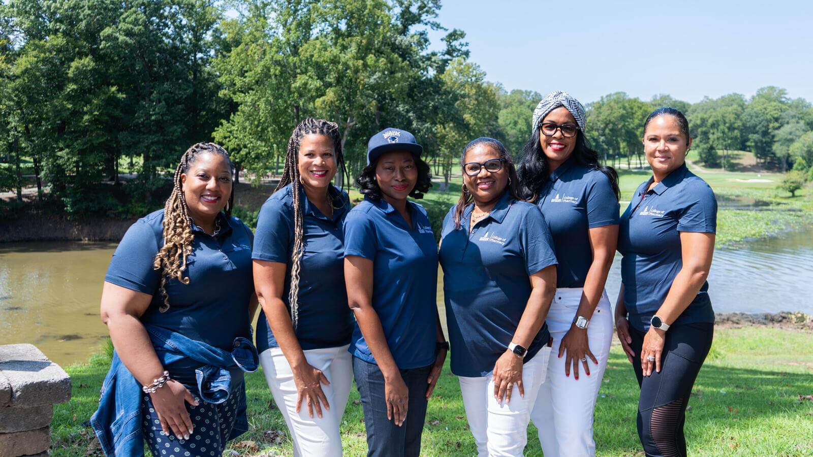 group of women standing in line at golf course