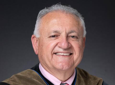 Dr. Karodeh Headshot DarkGreyBackground
