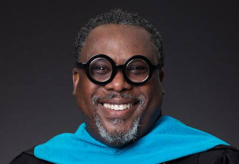 Dr. Ettienne Headshot DarkGreyBackground