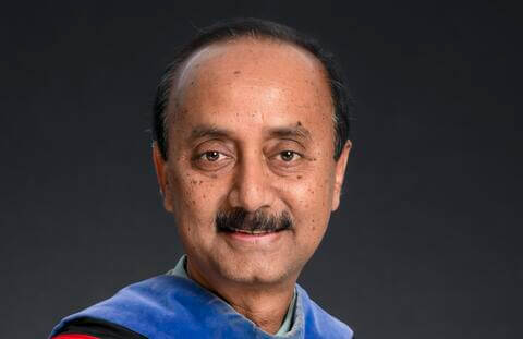 Dr. Habib Headshot DarkGreyBackground