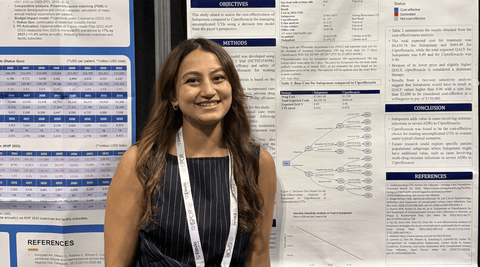 headshot of a women in front of poster presentation
